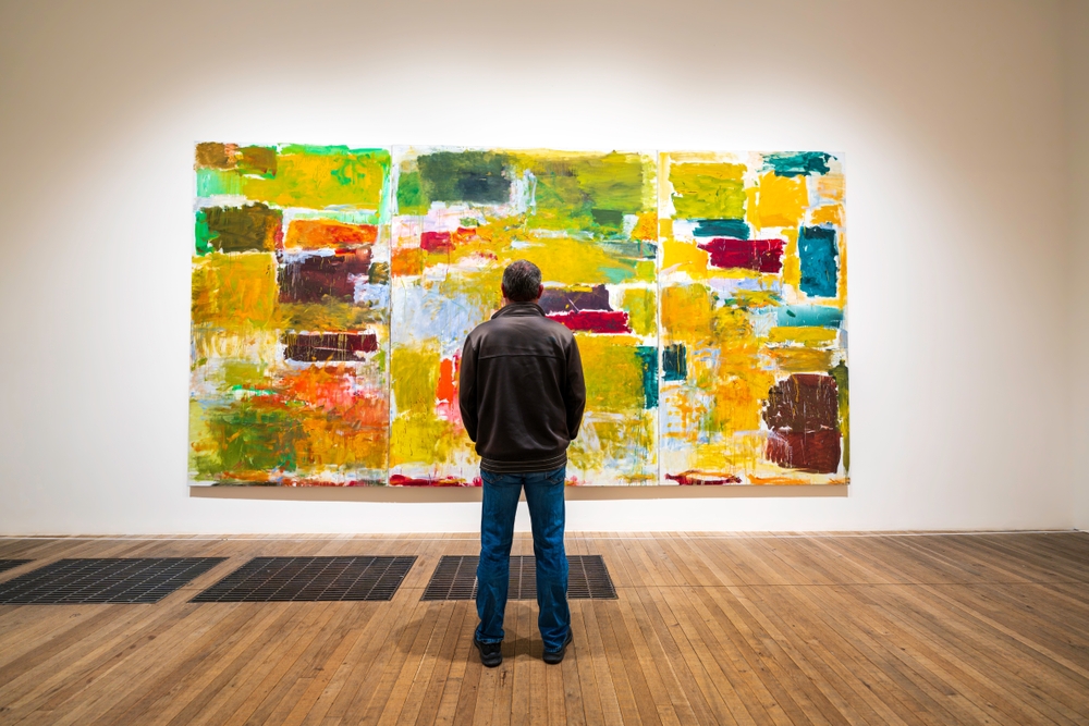 Gallery visitor viewing an abstract painting at a London museum
